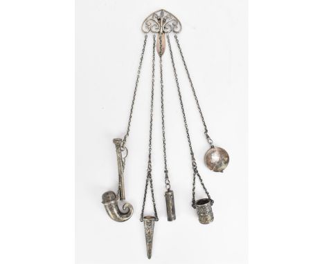 An Edwardian silver chatelaine by Hilliard &amp; Thomason, London 1901, the clip with scrolled design, issuing five chains ho