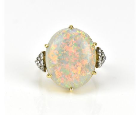 An Art Deco 18ct yellow gold, diamond and opal dress ring, with large central white/fire opal cabochon in six claw setting, f