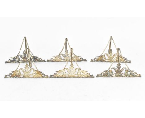 A set of six Edwardian silver menu/place card holders by Marples &amp; Co, designed with swans drinking either side of a cent