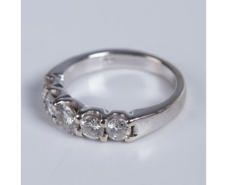 White gold ring marked 14k inside the band. The center diamond measures approximately 5mm and the others measure approximatel