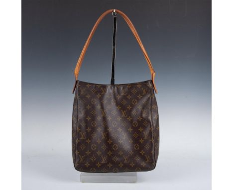 Authentic Louis Vuitton monogram hoop bag with coated washable canvas and leather top handle. The central zipper opens to a s