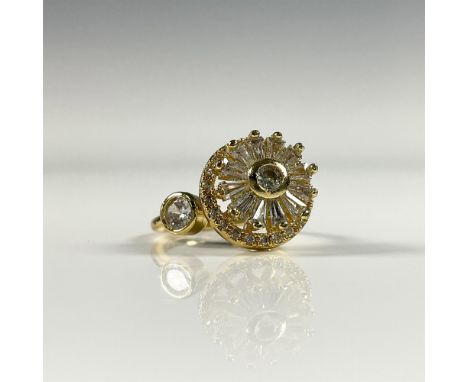 Fabulous gold tone ring set with crystals. It has stacked layers and the top one can be rotated. Size 4.5, but can be adjuste