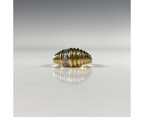Ridged 14k gold ring set with four small round diamonds and marked inside the band. Size 7. Dimensions: See DescriptionCondit