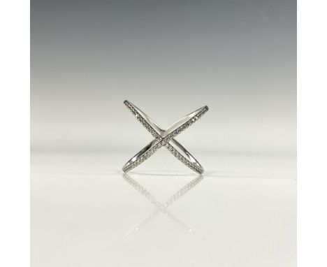Beautiful silver ring formed of two intersecting arcs. It is marked 925 inside. Approximately size 9. Dimensions: See Descrip