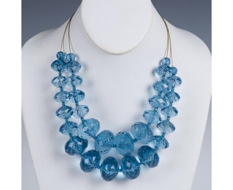 Two strands of large light blue beads on gold tone wire. Joan Rivers tag near the clasp. It measures approximately 22.5"L end