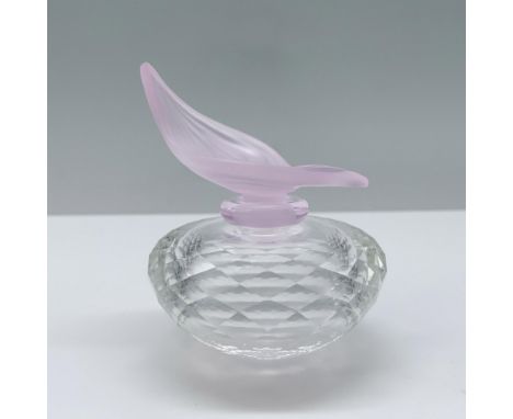 A flacon with a clear diamond cut body and a soft pink stopper elegantly shaped like a rose petal. Swarovski backstamp. This 
