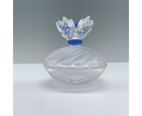 A stunning jewelry box with a clear bottom half and a frosted top half featuring gentle wave patterns, topped with an exquisi
