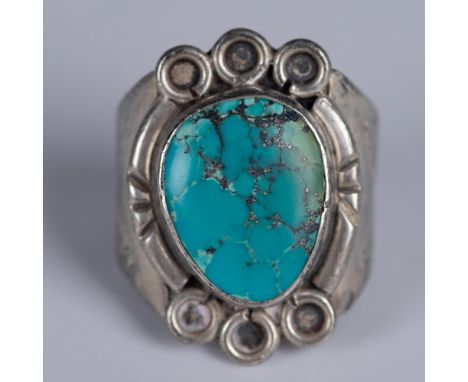 Bold Southwestern style sterling silver ring with a large turquoise stone. It is marked Sterling inside the band. 14g total w