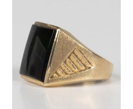 This gorgeous ring has an engraved 14k yellow gold band with a large square onyx center stone. It is marked 24k EMI inside th