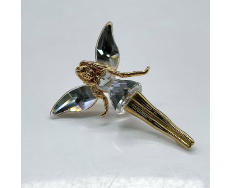 Lovely, gilded figure with crystal wings and dress. Swarovski impressed mark. This item has its original box: 2"L x 2.5"W x 1