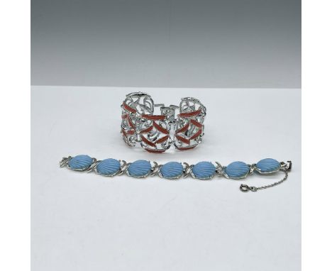 Costume jewelry lot includes silver toned cuff bracelet with orange enamel (7"L) and blue shell with silver toned link bracel