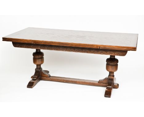 EARLY 20TH-CENTURY OAK DINING SUITE
comprising of a sideboard, the table with cup and cover baluster supports, 273cm long, 92