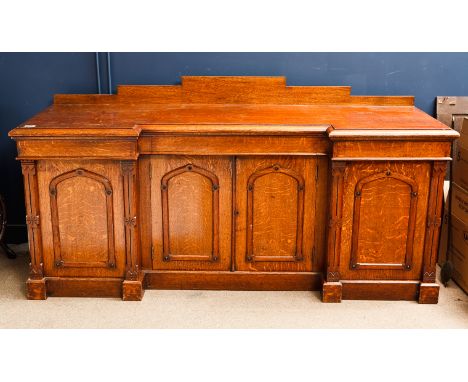 LATE VICTORIAN INVERSE BREAKFRONT SIDEBOARD
with stepped pediment, three concealed drawers below the moulded rectangular top,