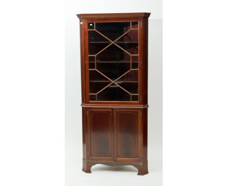 LATE VICTORIAN LINE INLAID MAHOGANY CORNER DISPLAY CABINET
with astragal door, on canted bracket feet, 191cm high
