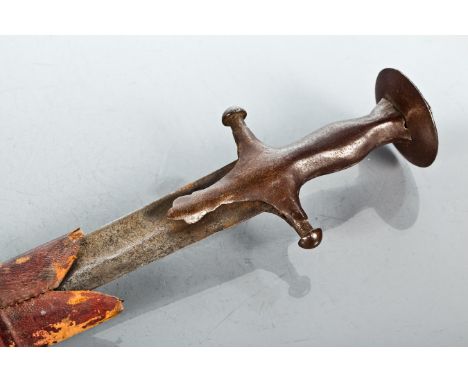 INDIAN TULWAR SWORD
circa 1900, in a burgundy leather scabbard, 98cm long