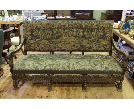 Impressive tapestry and carved frame sofa, the seat and back with country scenes with animals, the frame with ancanthus carve