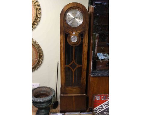 1930's oak triple weight longcase clock with silvered dial.