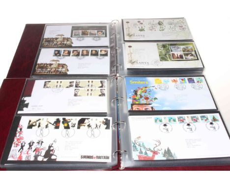 Eight albums of first day covers.