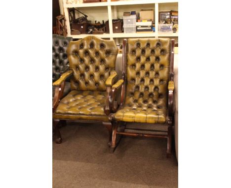 Two light green buttoned leather mahogany framed occasional armchairs.