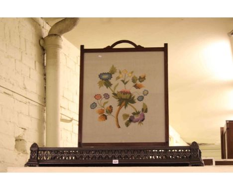 Mahogany framed needlework firescreen and two cast metal pierced fenders.
