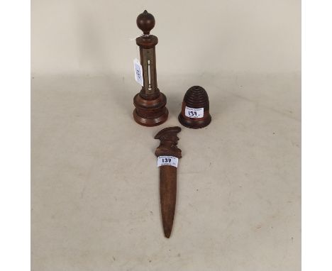 A Treen lighthouse thermometer, a Bakelite bee hive vesta plus a wood letter opener