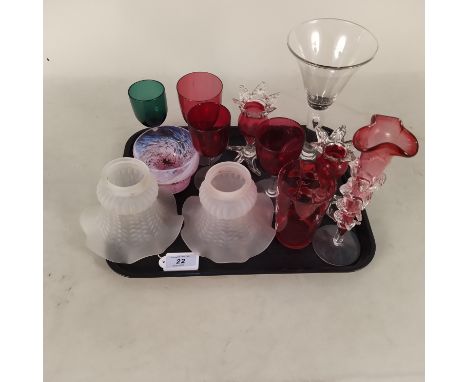 A small collection of glassware including cranberry wine glasses, a decorated beaker and three vases plus a large hand blown 