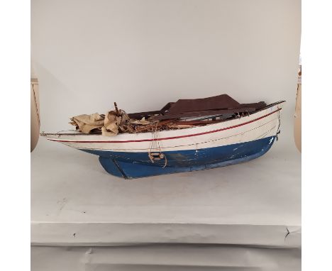 A wooden model boat c1900 (with masts and rigging as found), 44" long