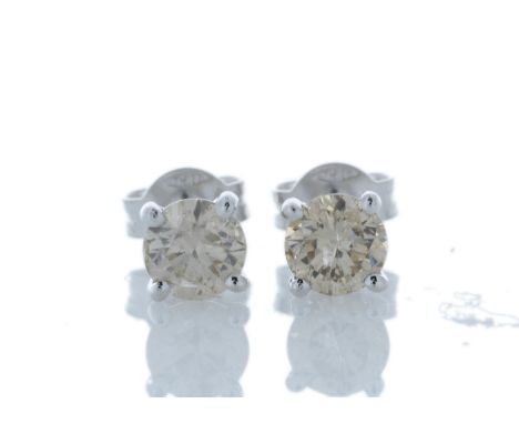 Two natural round brilliant cut diamonds are set in these classic 18ct white gold diamond stud earrings. Each diamond measure