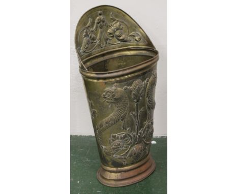 Victorian oval embossed brass stick stand, 69cm high.