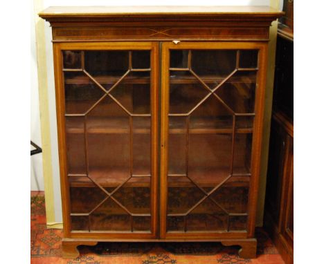 Victorian mahogany astragal glazed bookcase on bracket feet, 125cm high and 106cm wide.