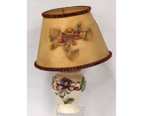 Moorcroft Clematis pattern table lamp of baluster form, 34cm high overall.