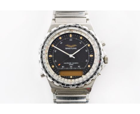 A BREITLING NAVITIMER QUARTZ 3300 GENTLEMAN'S STEEL BRACELET WRISTWATCHThe signed black dial with Arabic numerals, digital ap