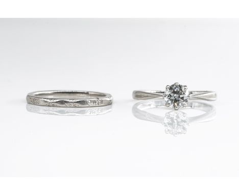 A DIAMOND SINGLE STONE RING AND A PLATINUM BAND (2)The single stone featuring an old cut diamond in a claw setting, (estimate