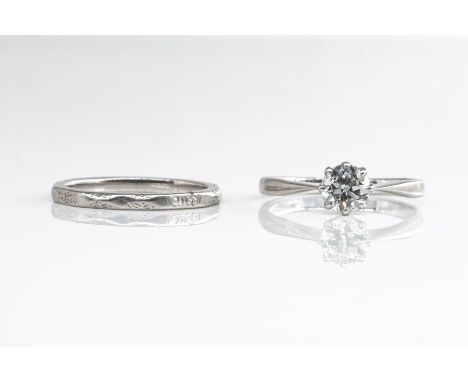 A DIAMOND SINGLE STONE RING AND A PLATINUM BAND (2)The single stone featuring an old cut diamond in a claw setting, (estimate