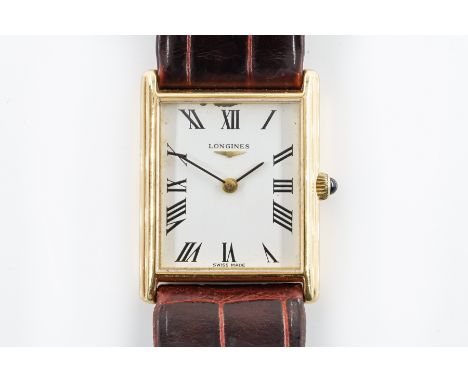A LONGINES GOLD RECTANGULAR CASED WRISTWATCHWith a signed jewelled circular movement, numbered 54075868, the signed white dia