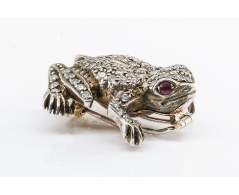 A DIAMOND AND RUBY FROG BROOCHThe frog set with round cut diamonds with ruby set eyes, unmarked but presumed gold and silver,