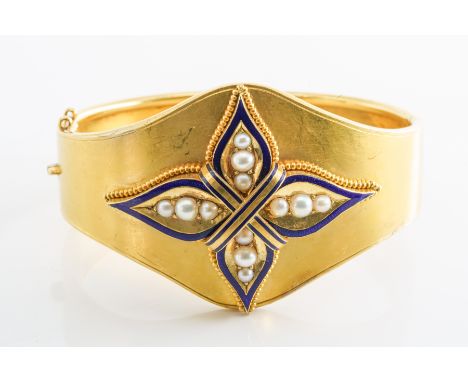 A VICTORIAN PEARL AND BLUE ENAMEL BANGLE/CUFFSet with royal blue enamel, and twelve half pearls, with a tongue and clip clasp