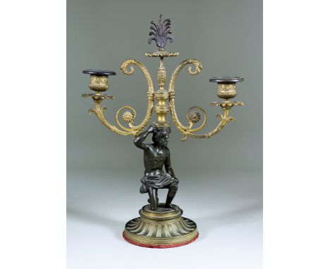 A 19th Century French Bronze and Gilt Metal Two Light Candelabrum, in Empire manner, 15ins high