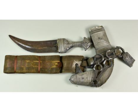 A Saudi Arabian Presentation Jambya Dagger, Early 20th Century, with silvery metal sheath and hilt, 13.5ins overall
