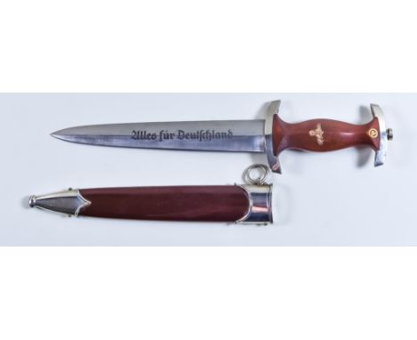 A German World War II NSKK Dagger, makers mark RZ in circle over M, M7/661940, 9ins bright steel double edge blade, etched wi