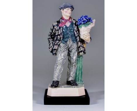 A Charles Vyse Pottery Figure - "The Cineraria Boy", circa 1925, modelled as a standing figure of a young man holding a bunch