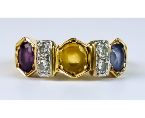 A Coloured Sapphire and Diamond Ring, Modern, yellow metal set with three faceted sapphires, of blue, yellow and purple colou