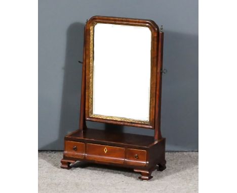 A George III Mahogany Rectangular Toilet Mirror, with arched top and gilt slip with bevelled mirror plates, on rectangular up