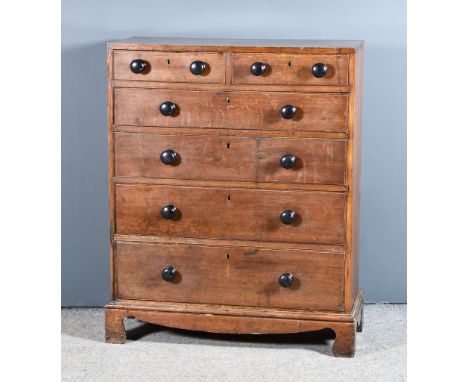 A 19th Century Oak Chest of Drawers with square edge to top, fitted two short and four long graduated drawers, with turned eb