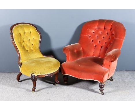 A Victorian Walnut Framed Spoon Back Nursing Chair and an Easy Chair, the nursing chair with frame carved with scroll and ber