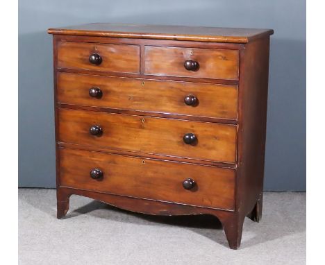 A Victorian Mahogany Chest, with square edge to top, fitted two short and three long graduated drawers, on shaped apron and w