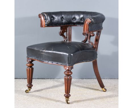 A Victorian Mahogany Tub Shaped Library Armchair, with horseshoe shaped back, leaf, scroll and shell carved lyre pattern spla