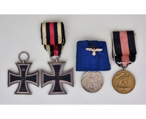 Four German Medals, comprising - two German Iron Crosses, one World War I, the other World War II, a silvery metal German for