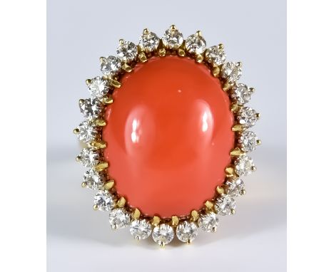 A Cabochon Coral and Diamond Ring, Modern, 18ct gold set with a centre cabochon coral stone, 16mm x 20mm, surrounded by diamo