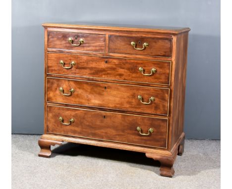 A George III Mahogany Chest, with moulded edge to top, fitted two short and three long graduated drawers, on ogee bracket fee